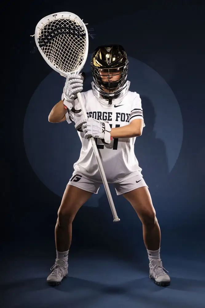 George Fox lacrosse goalie standing ready