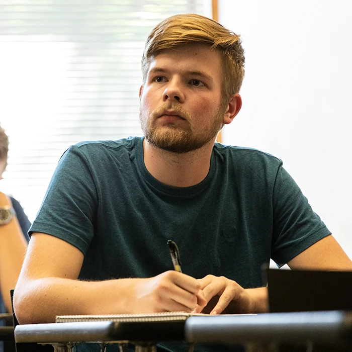 Student editing audio on computer