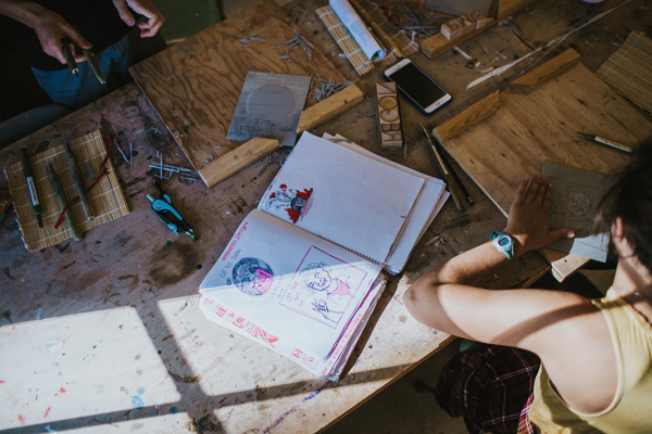 Students work at a table together