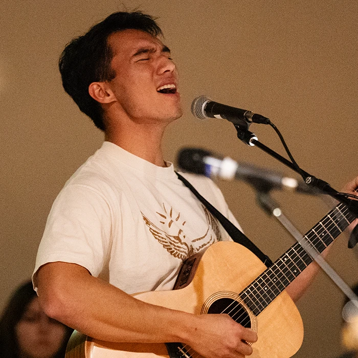 Student singing a worship song