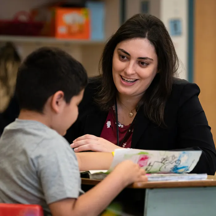 Teacher with an elementary school kid