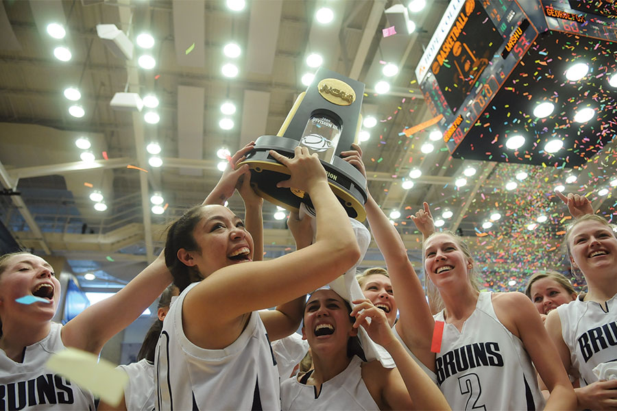 George Fox Women's Basketball team with their championship trophy