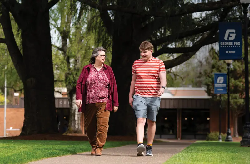 Ben and college professor Kelly walk on campus