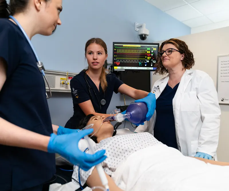 CRNA student learns from professor in clinical setting