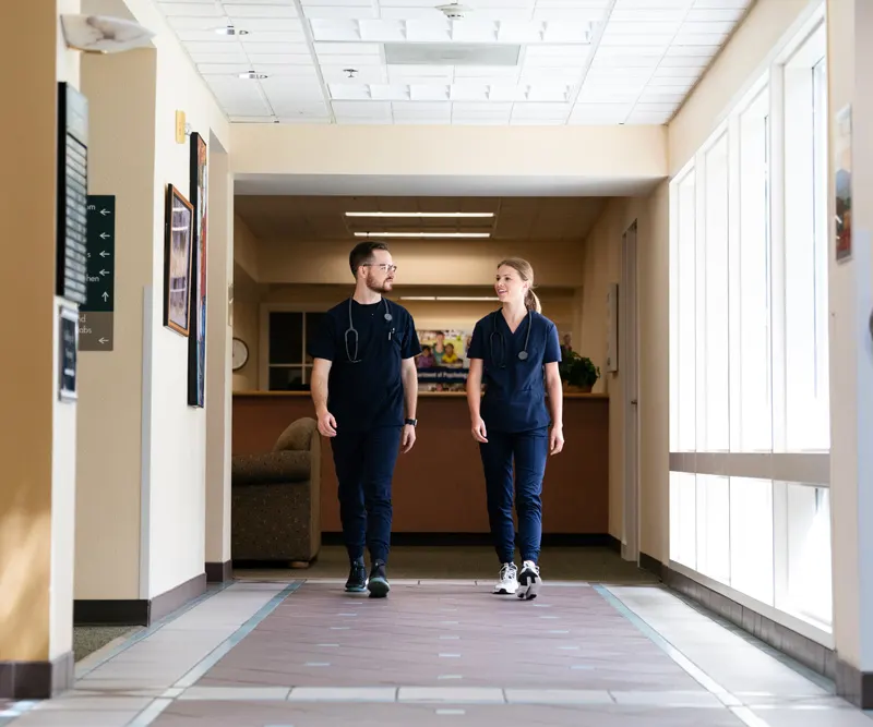 CRNA students walk through the medical building