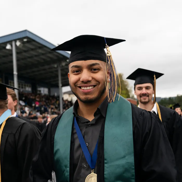 Student smiles at graduation