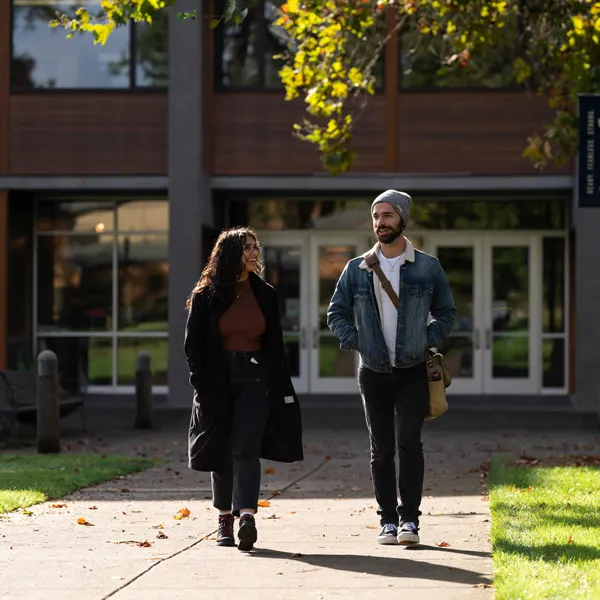 Psyd students walk through George Fox's campus